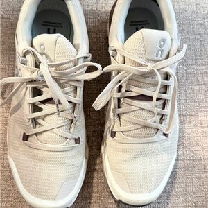 On Running Beige and White Athletic Shoes